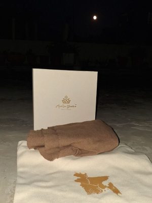 Handwoven Cervelt Grand Shawl folded beside the Muslin Dhaka presentation box
