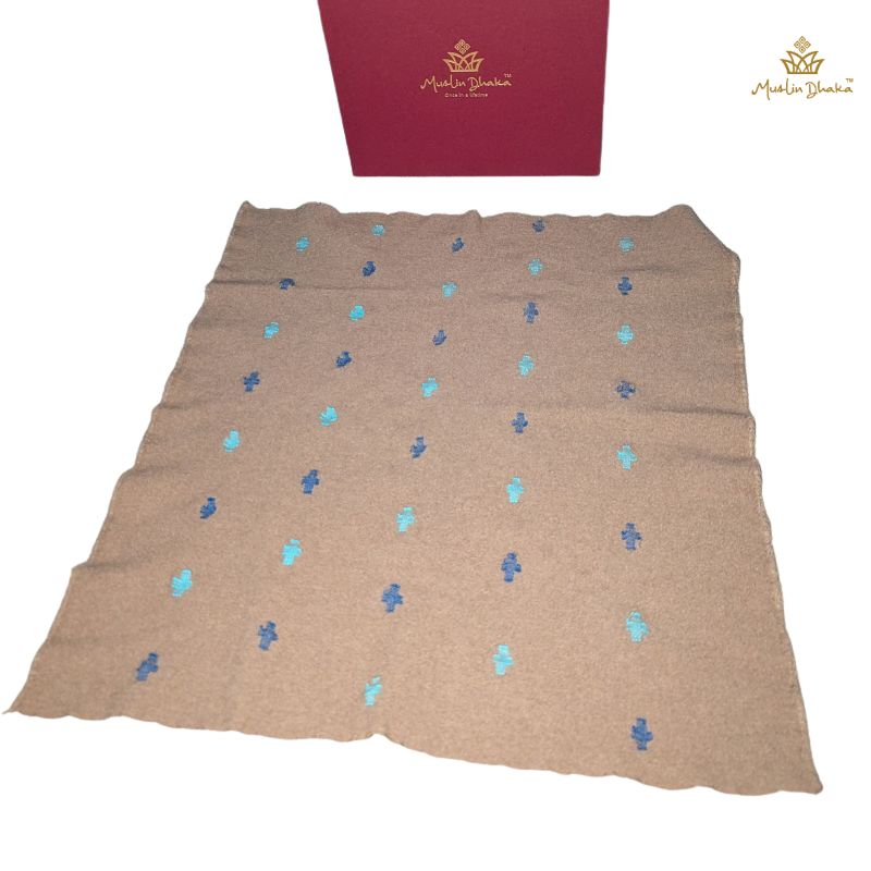 Cervelt pocket square laid flat beside the Muslin Dhaka presentation box